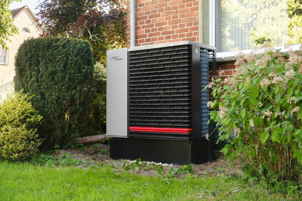 Outdoor energy-efficient HVAC unit installed beside a home to improve heating, cooling, and indoor comfort.